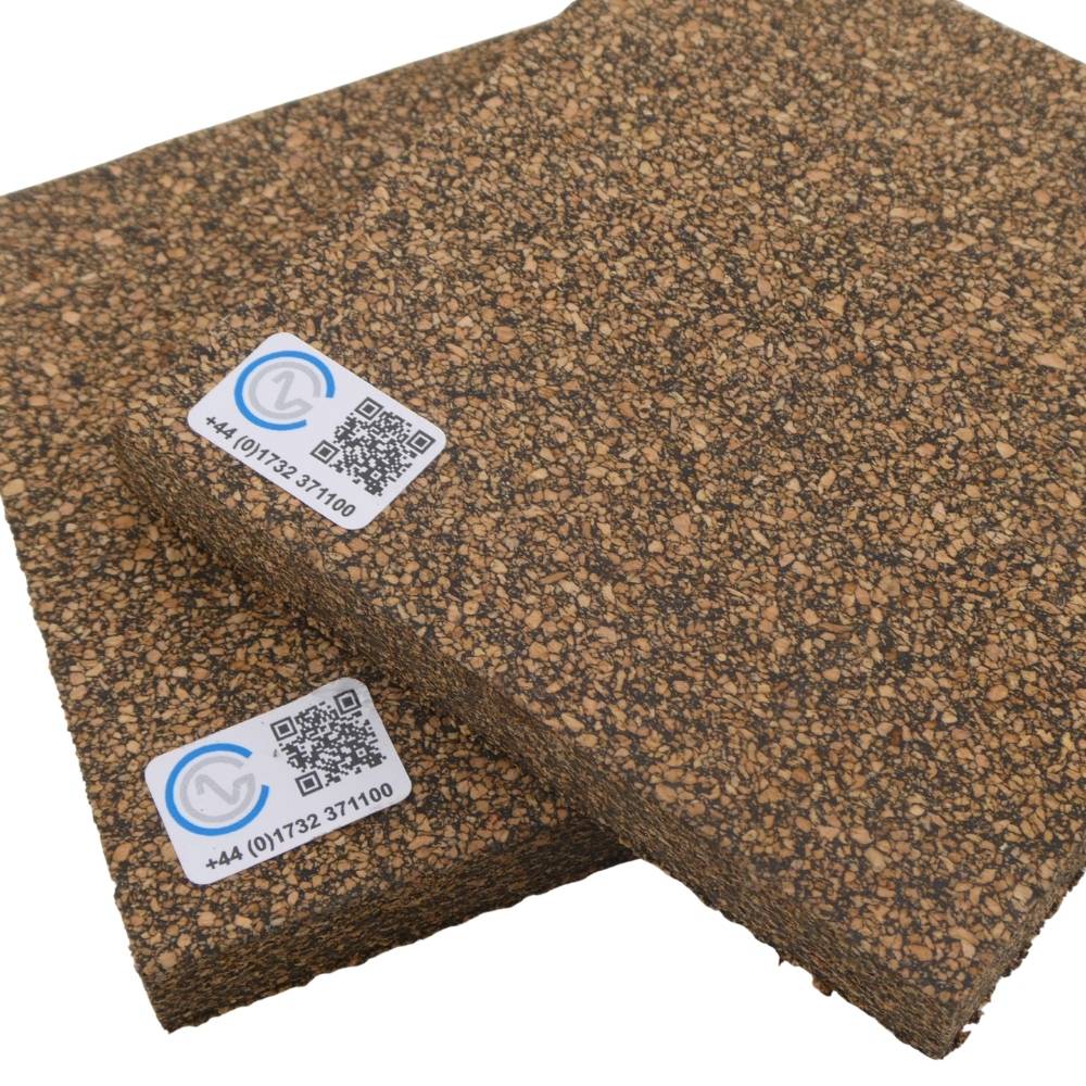 A close-up of two pieces of Neoprene Bonded Cork on a white backdrop