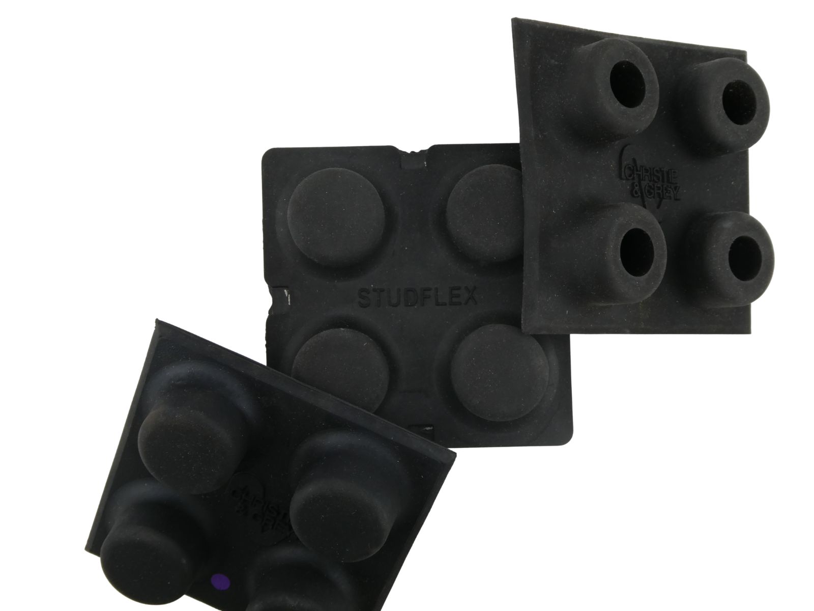 Three Studflex mats and pads, taken from above